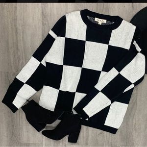 black and white sweater, size large